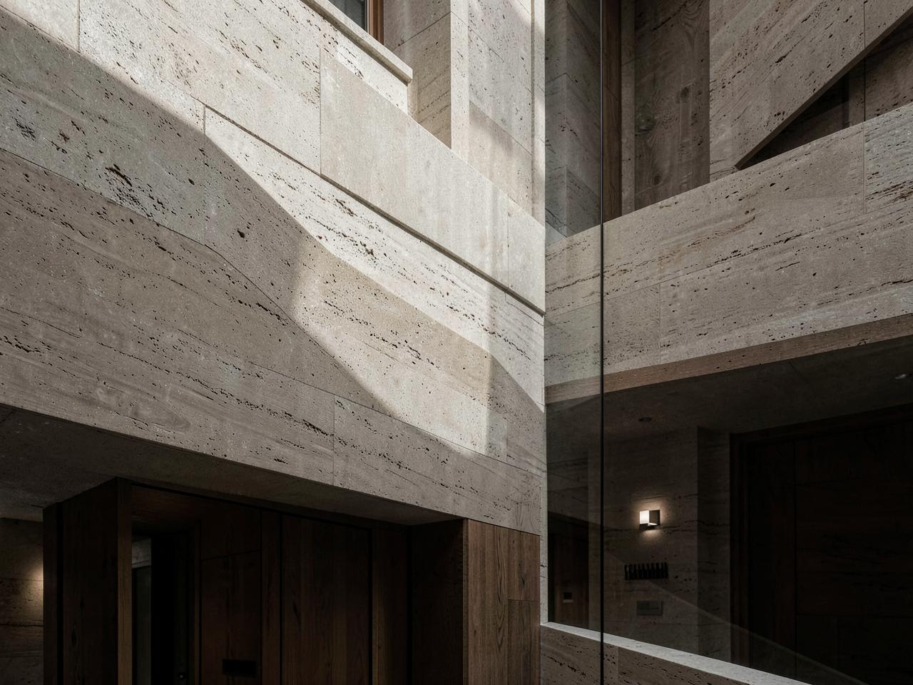 Restrained stone and timber architectural interior